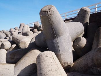 Low angle view of old sculpture against sky