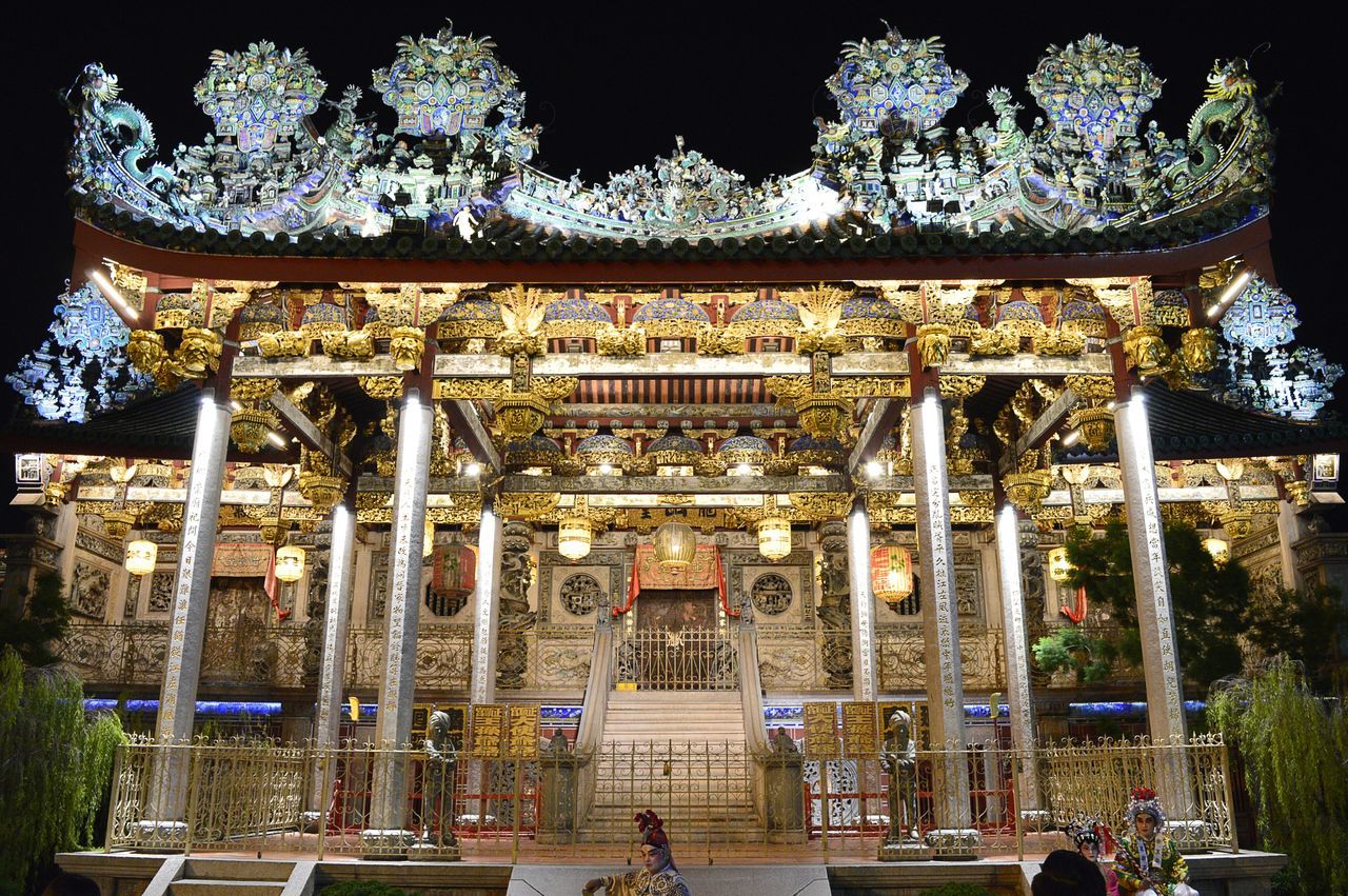 built structure, architecture, tree, flower, decoration, building exterior, ornate, place of worship, religion, day, hanging, potted plant, railing, outdoors, entrance, chair, architectural column, no people, culture, park - man made space