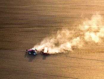 Aerial view of tractor working on agricultural field