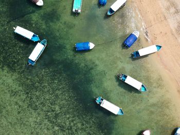 Directly above shot of boats moored in sea