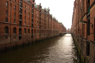 Scenic view of canal along buildings