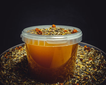 Close-up of breakfast on table against black background