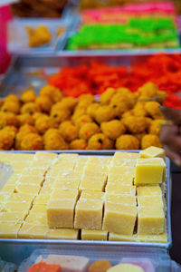 Indian assorted sweets or mithai for sale during deepavali or diwali festival at the market.