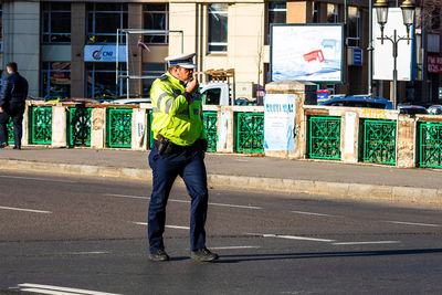 Full length of man standing on road