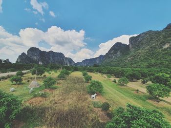 Scenic view of landscape and mountains against sky