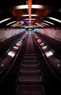 Low angle view of illuminated escalator