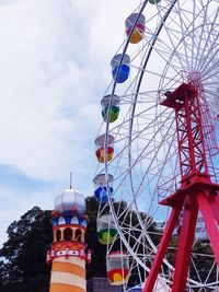 Low angle view of ferris wheel against sky