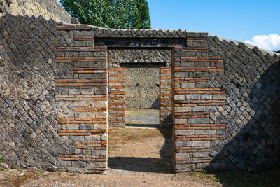 Brick wall with closed door of building