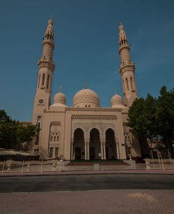 Facade of historic building against clear sky