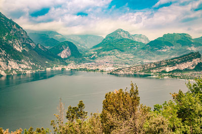 Scenic view of lake and mountains against sky