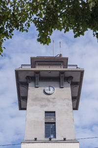 Low angle view of clock tower against sky