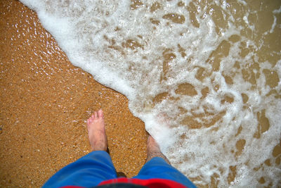 Low section of person on beach