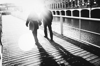 Rear view of couple walking outdoors