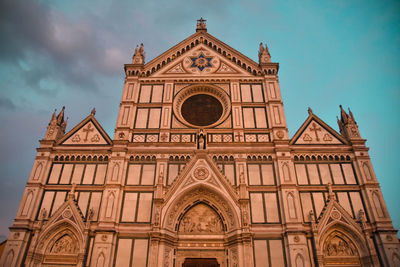 Low angle view of ornate building against sky