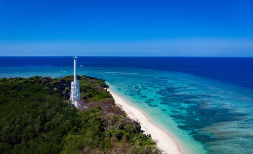 Scenic view of sea against clear blue sky