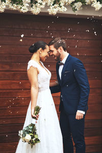 An interracial couple on their wedding day. a happy young man and woman in love getting married