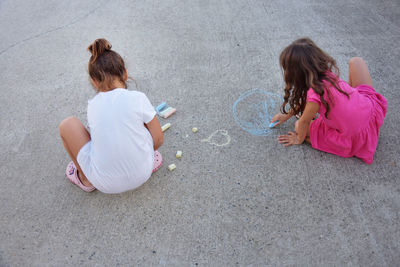 High angle view of girl playing on the floor