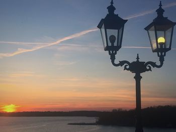 Street light against sky during sunset