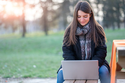 Young woman using mobile phone