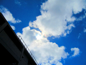 Low angle view of building against cloudy sky