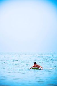 Man swimming in pool