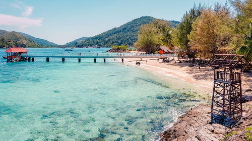 Scenic view of swimming pool by sea against sky