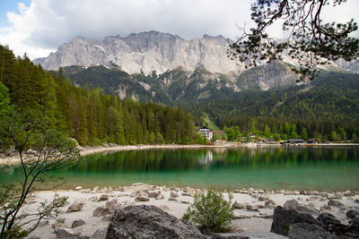 Scenic view of lake and mountains against sky