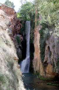 View of waterfall in forest