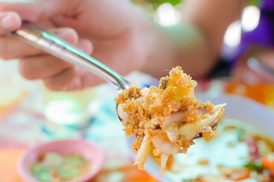 Close-up of hand eating food
