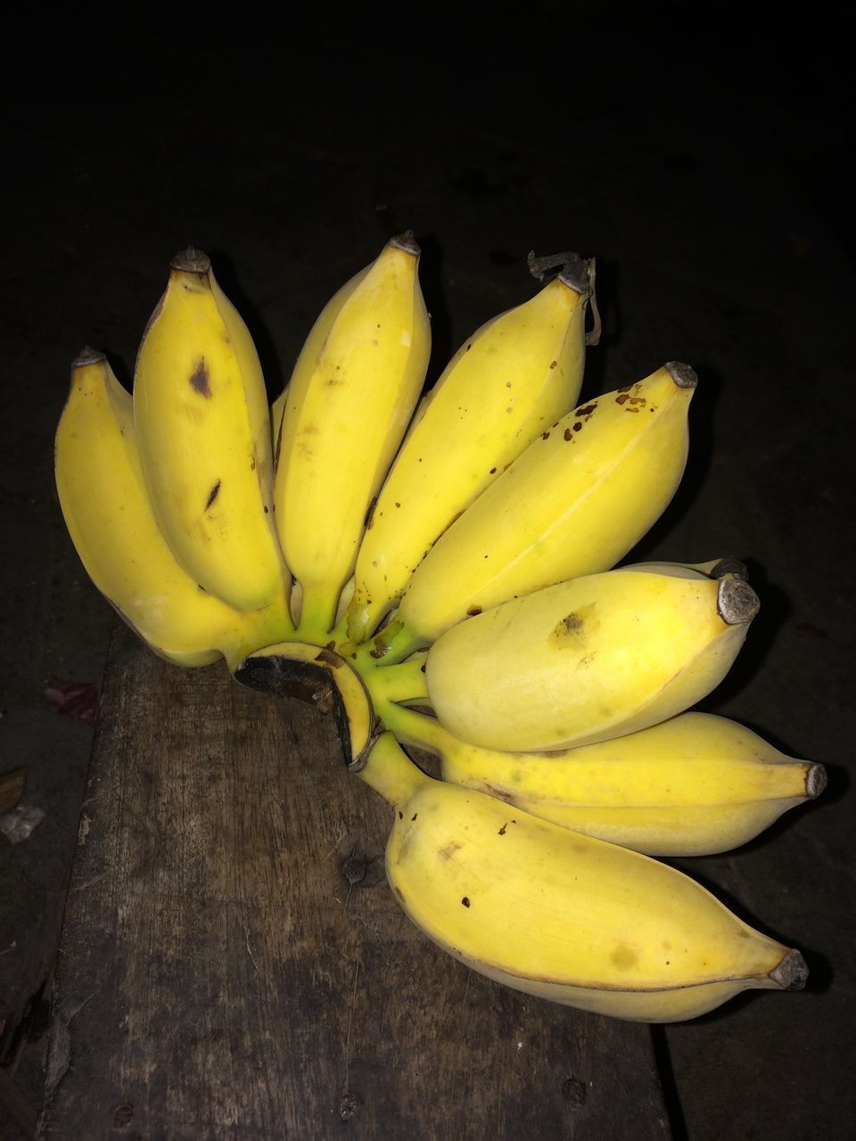 HIGH ANGLE VIEW OF YELLOW FRUIT ON FLOOR