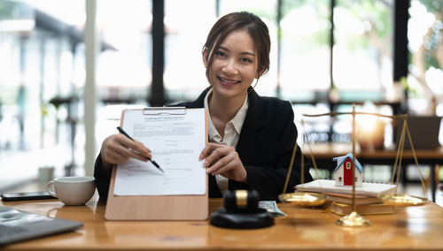 Businesswoman working on table