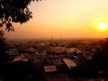 High angle view of townscape against sky during sunset