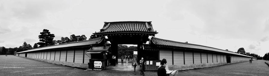 Low angle view of building against cloudy sky