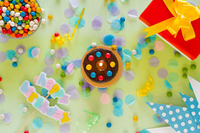 High angle view of multi colored paper on table