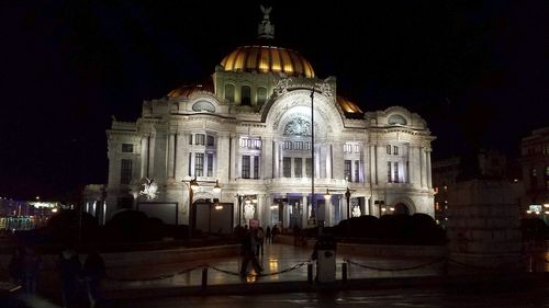 Low angle view of illuminated building at night