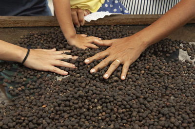 High angle view of couple hands