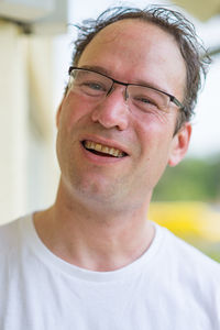 Close-up portrait of smiling mid adult man