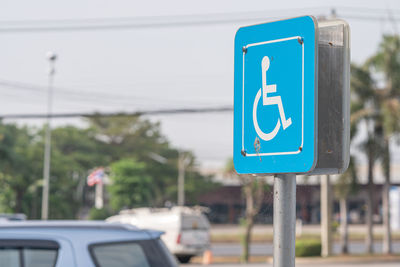 Blue accessibility sign in city