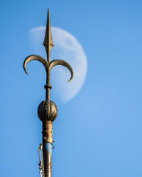 Low angle view of street light against sky