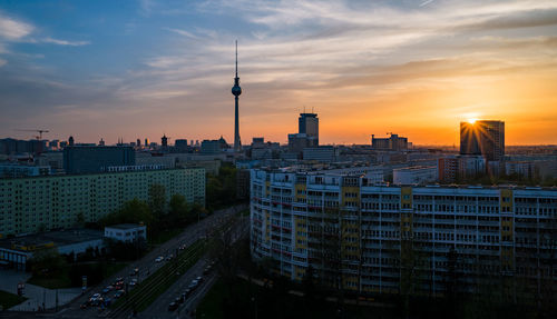 Buildings in city during sunset