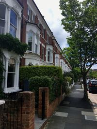 Street amidst buildings against sky