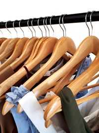 Close-up of clothes hanging on rack in store