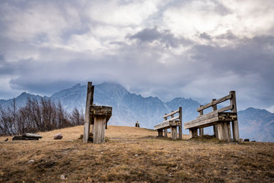 Built structure on field against sky