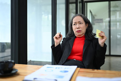 Portrait of businesswoman working at office