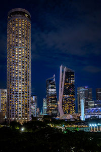 Illuminated buildings in city at night