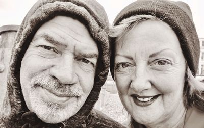 Portrait of smiling couple wearing warm clothing