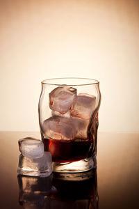 Close-up of beer glass on table