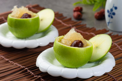 Close-up of fruits in plate on table