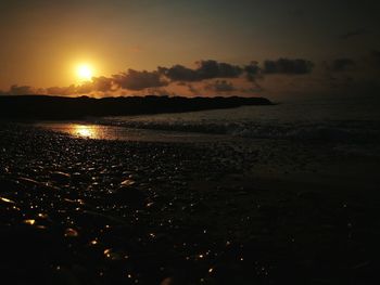 Scenic view of sea against sky at sunset