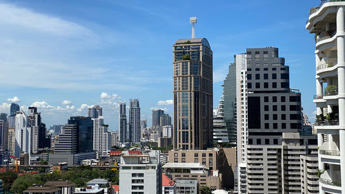 Modern buildings in phrom phong district of bangkok city against sky